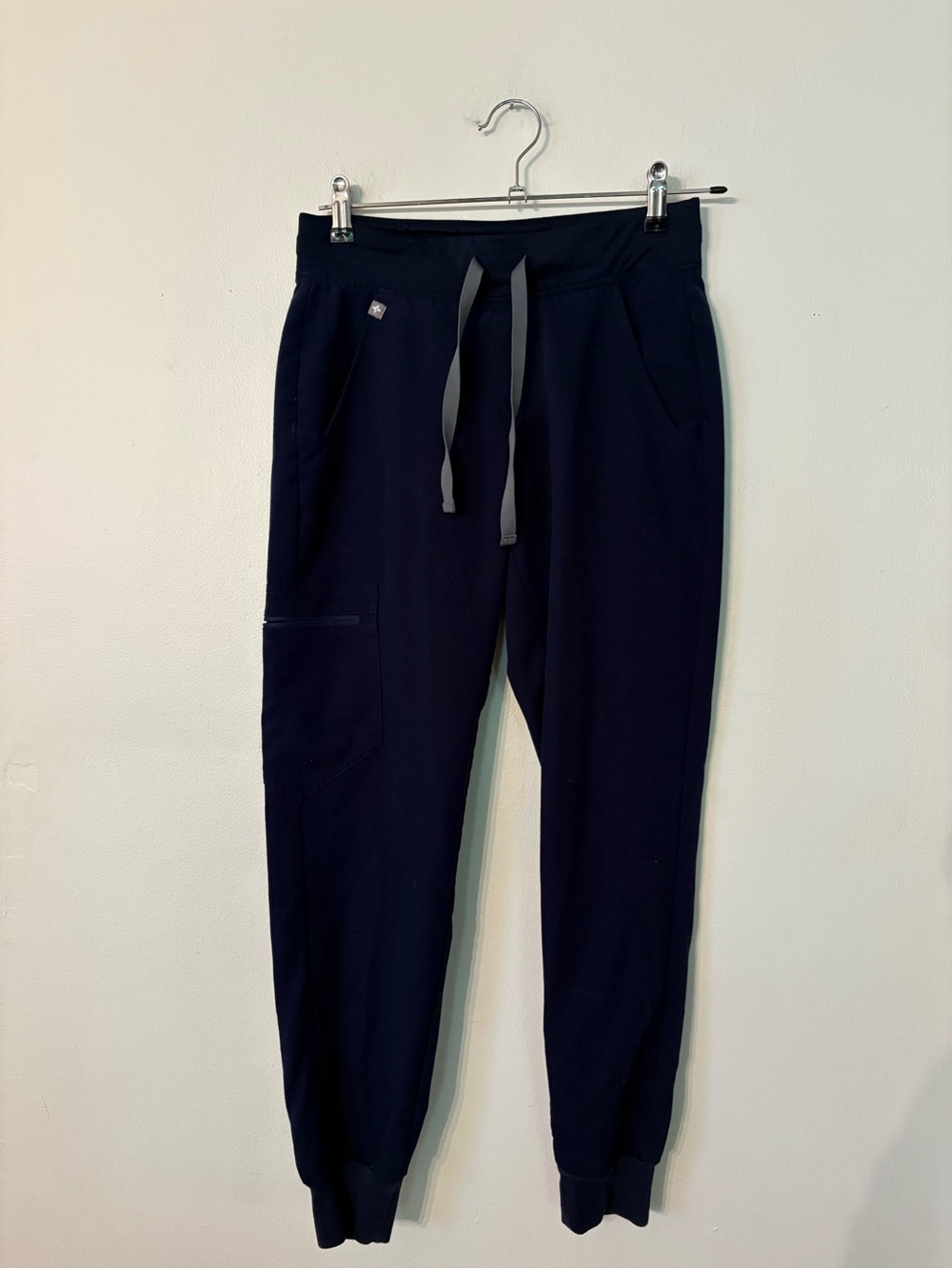 FIGS women’s scrub pants in Navy with Gray Drawstrings